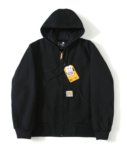 A black Carhartt J140 hooded jacket with a front zipper, kangaroo pockets, and a yellow hangtag, displayed against a plain white background.