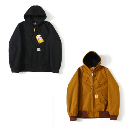 Two Carhartt hooded zip-up J140 jackets shown on a white background: one black jacket with a yellow hangtag and one mustard yellow jacket with brown ribbed trim and a visible Carhartt logo patch.